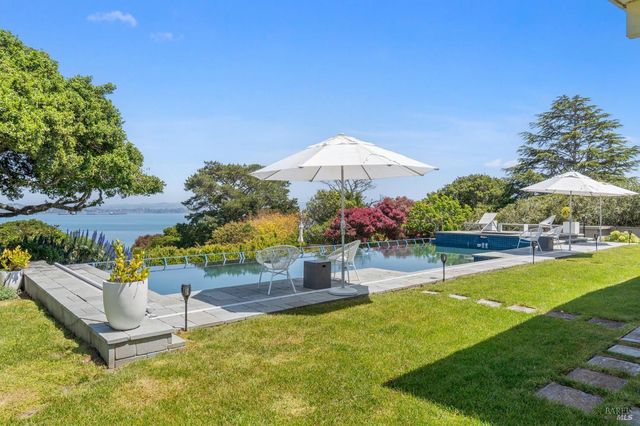 a view of a roof deck with wooden fence and floor