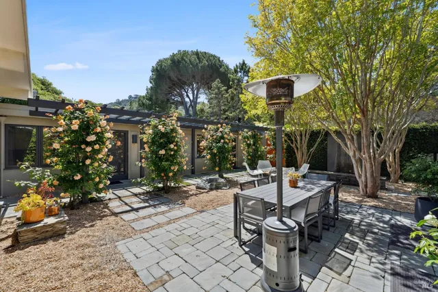 a view of a house with a tree