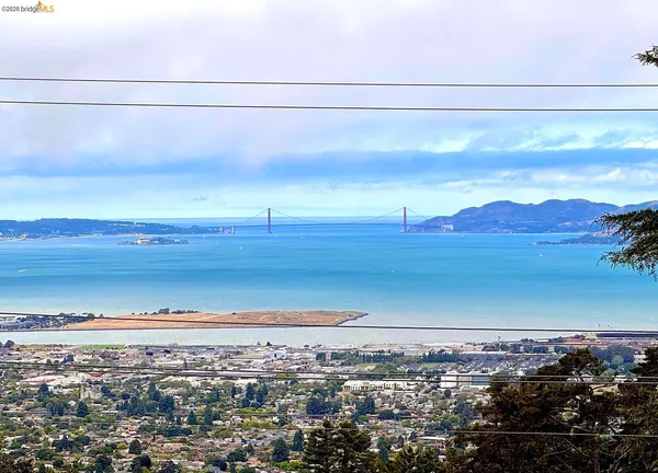 a view of a dining room with furniture wooden floor and chandelier