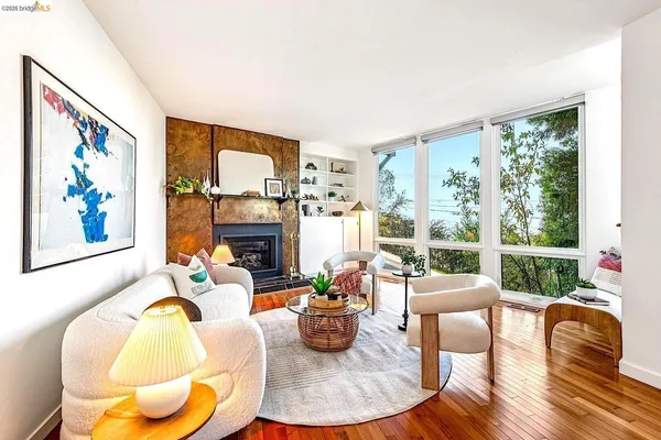 a bedroom with a bed lamp and a potted plant