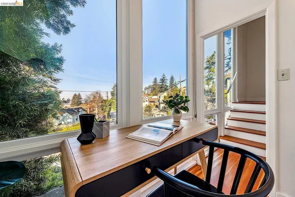 a view of a patio with couches and table and chairs and potted plants