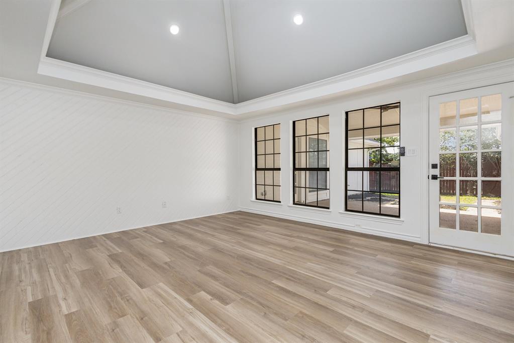 922 Sycamore Creek Road Allen, TX 75002 - Photo 20 of 38 Spare room with lofted ceiling, light wood-style floors, ornamental molding, and recessed lighting
