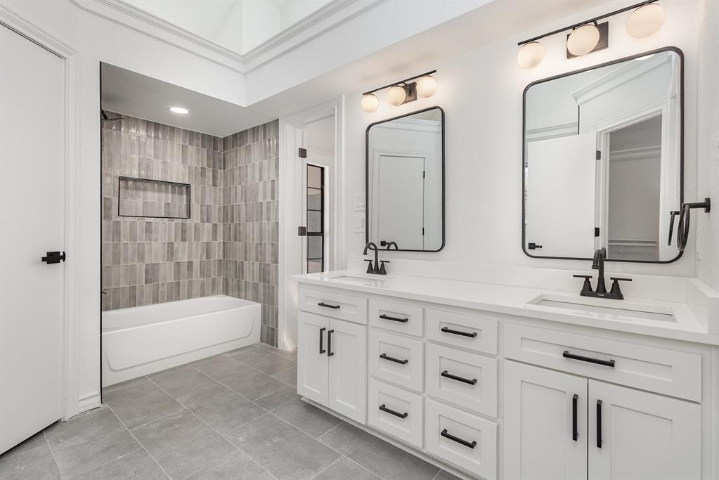 922 Sycamore Creek Road Allen, TX 75002 - Photo 4 of 38 Bathroom with double vanity, shower combination, and light tile patterned floors