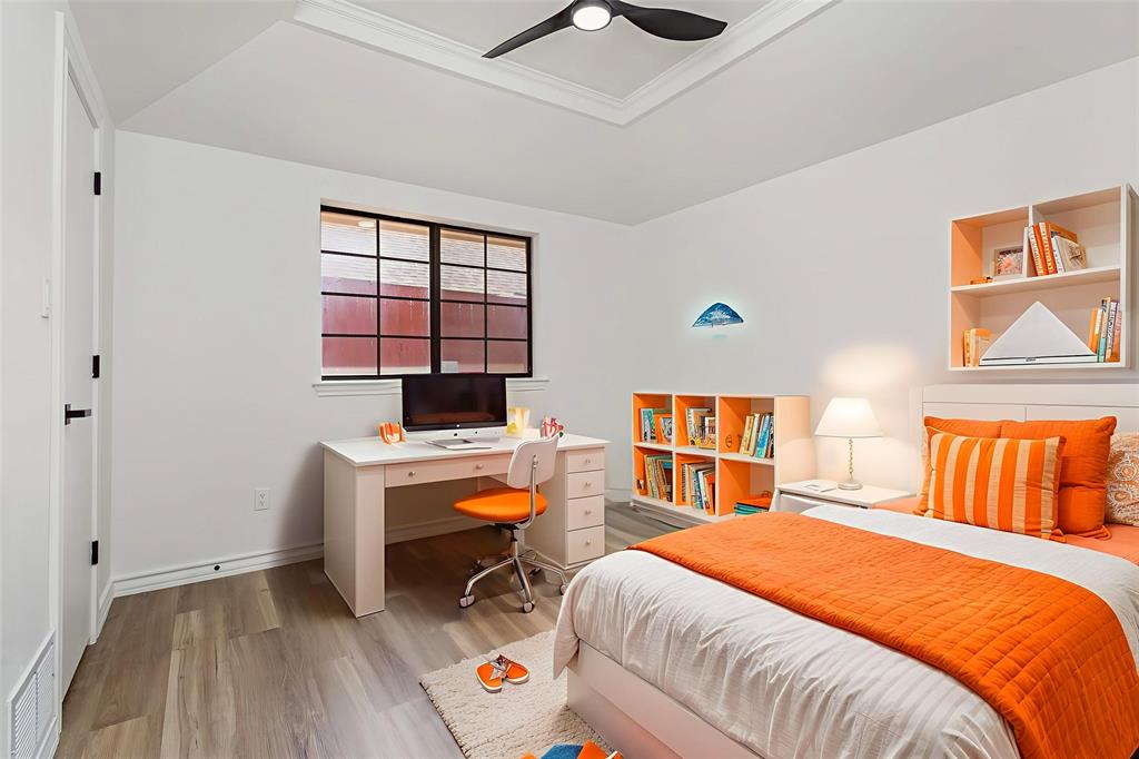 922 Sycamore Creek Road Allen, TX 75002 - Photo 10 of 38 Bedroom with light wood-style floors, ceiling fan, crown molding, and a desk