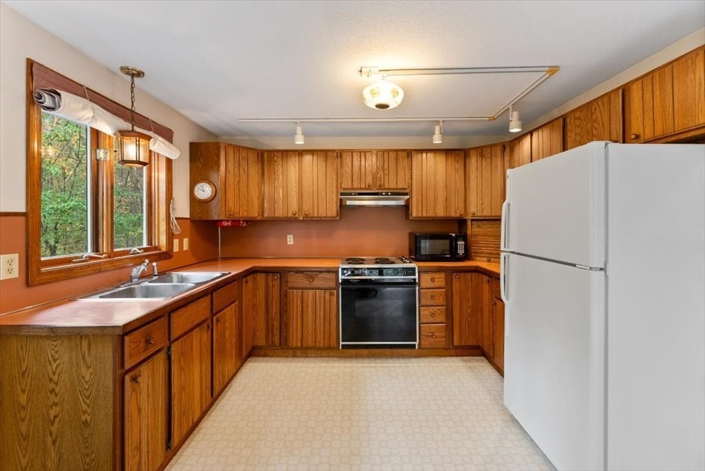 2172 Greenwich Road Hardwick, MA 01082 - Photo 15 of 42 a kitchen with stainless steel appliances granite countertop a refrigerator sink and cabinets