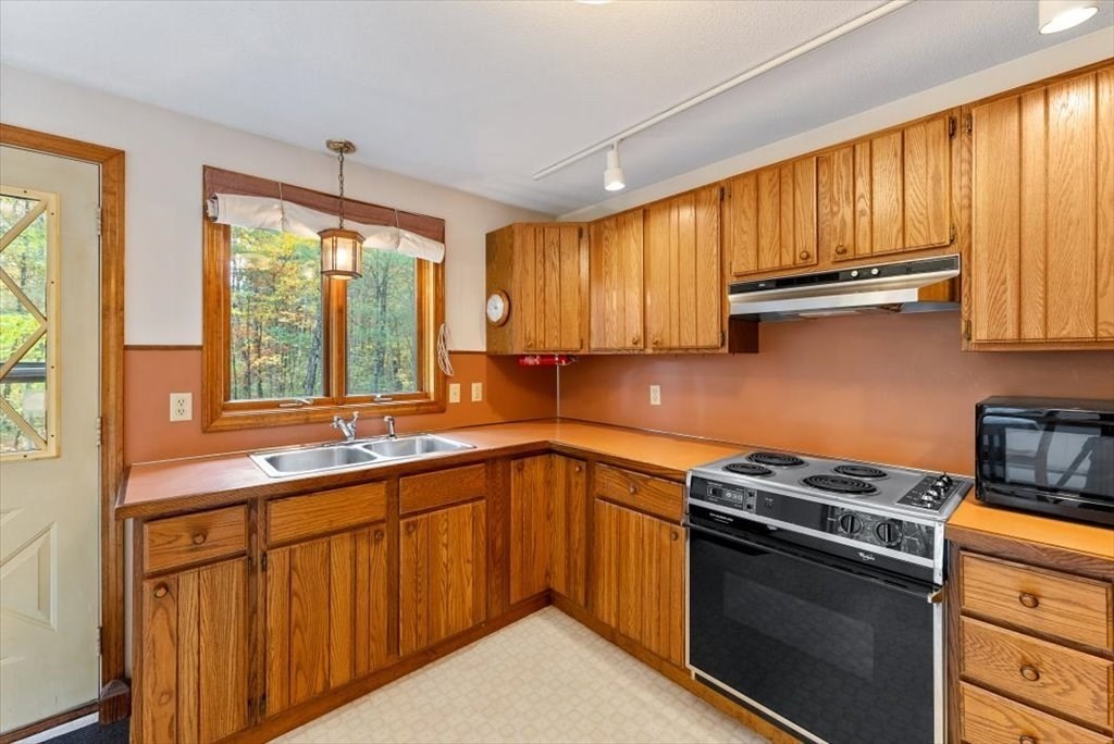 2172 Greenwich Road Hardwick, MA 01082 - Photo 16 of 42 a kitchen with stainless steel appliances a sink stove and cabinets