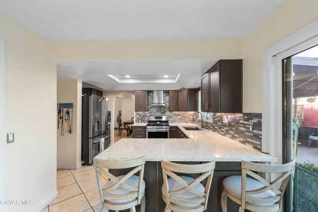 a kitchen with a table and chairs in it