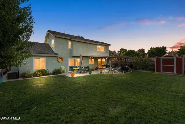 a view of house with outdoor space and yard