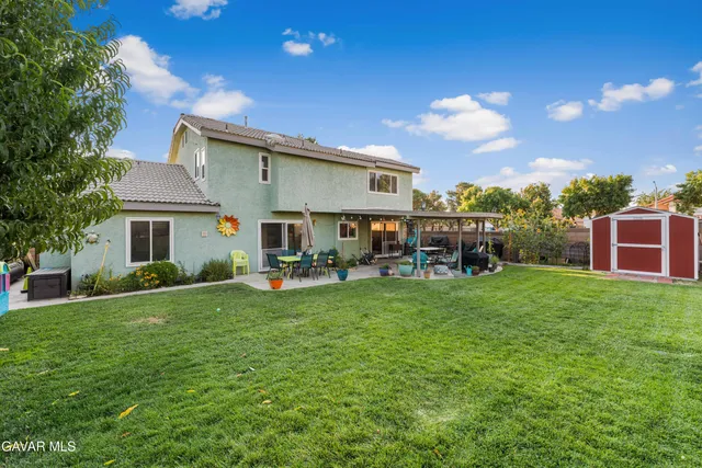 a view of a house with a back yard