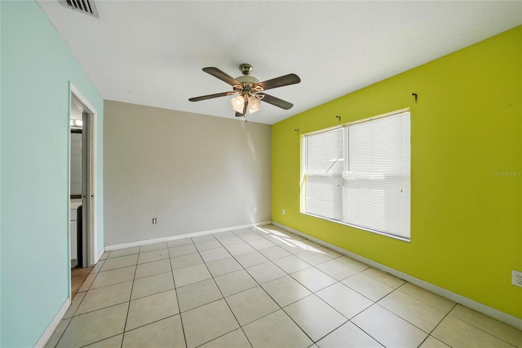 3 West Myrtle Street Arcadia, FL 34266 - Photo 16 of 41 a view of an empty room with a window and a kitchen