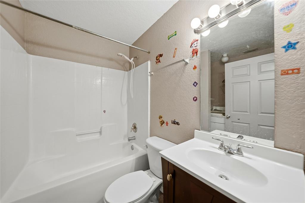 3 West Myrtle Street Arcadia, FL 34266 - Photo 23 of 41 a bathroom with a bathtub shower sink vanity and toilet
