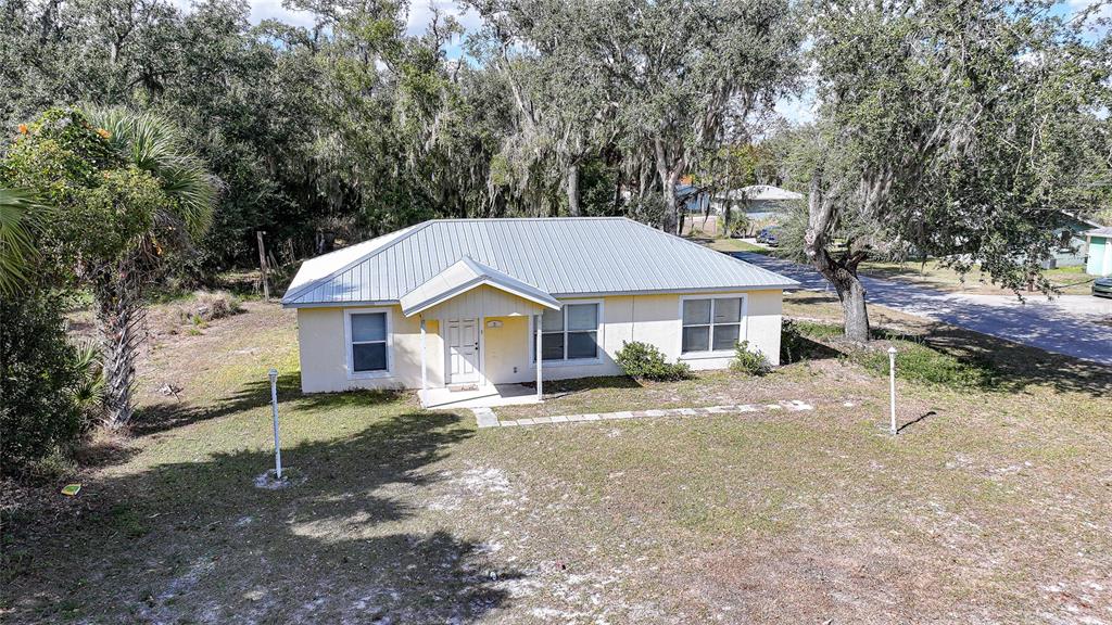 3 West Myrtle Street Arcadia, FL 34266 - Photo 3 of 41 a front view of a house with a yard and garage