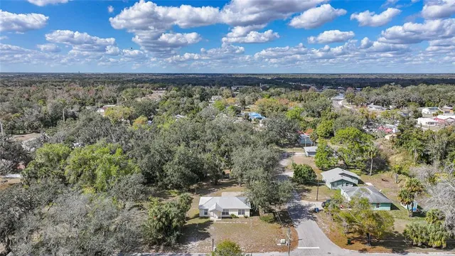 a view of a street with a building in the background