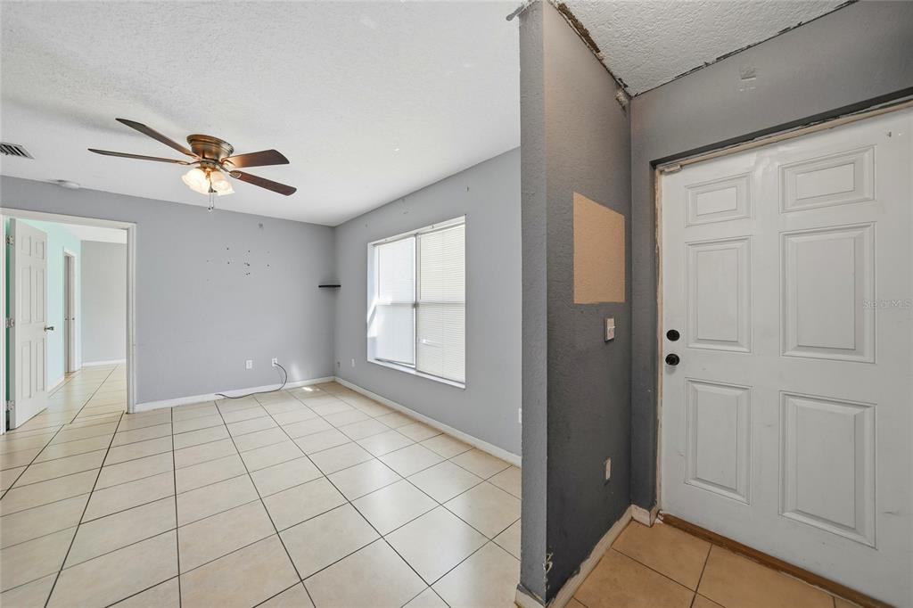 3 West Myrtle Street Arcadia, FL 34266 - Photo 5 of 41 wooden floor in an empty room with a window