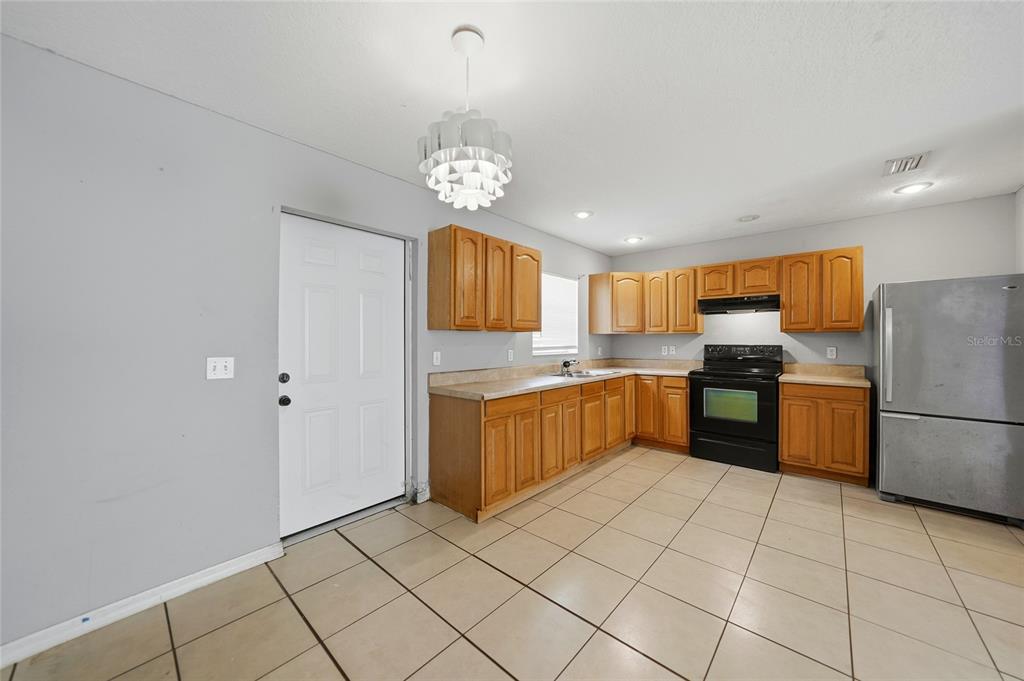 3 West Myrtle Street Arcadia, FL 34266 - Photo 9 of 41 a kitchen with a refrigerator a sink and dishwasher