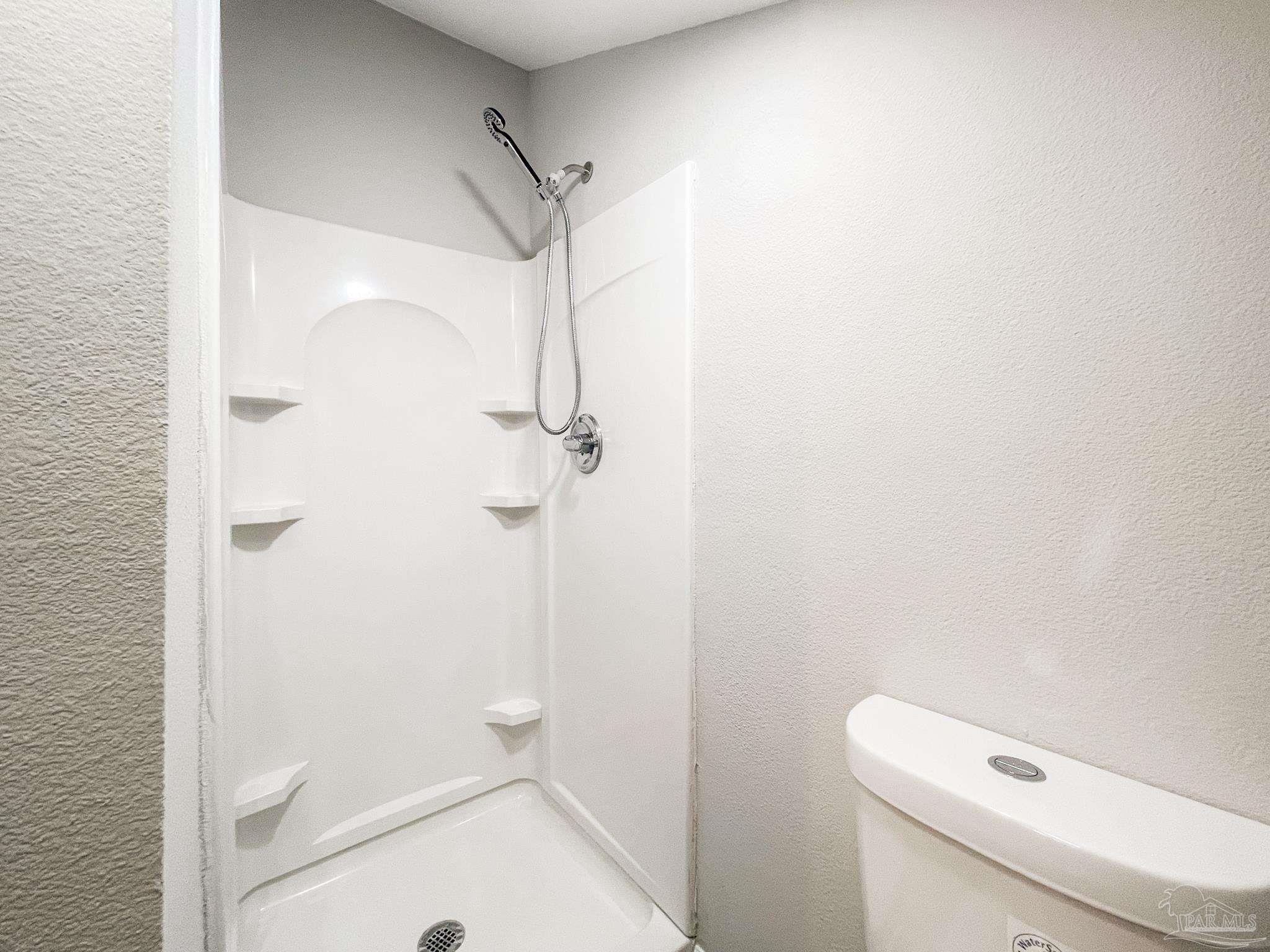 7200 Sharp Reef, Unit 2 Pensacola, FL 32507 - Photo 20 of 24 a bathroom with a shower and toilet