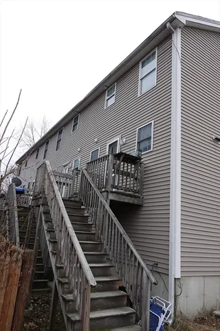 a view of a house with wooden stairs