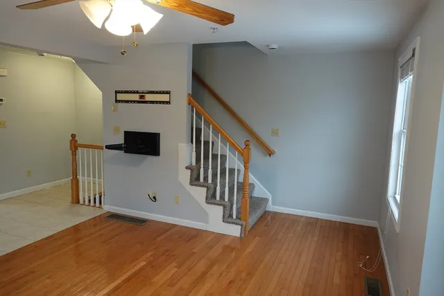 a view of entryway with wooden floor