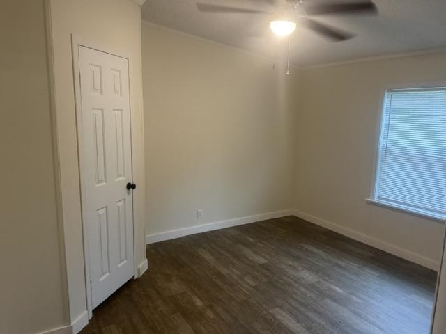 1100 Pine Top Road Toone, TN 38381 - Photo 17 of 40 Room featuring wood-finish flooring, neutral wall tones, and a multi-pane window with blinds