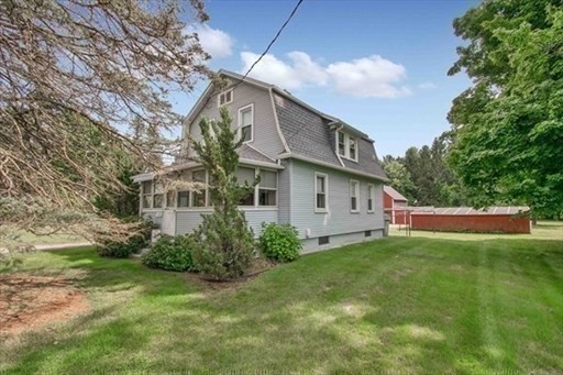1307 Burnett Road Chicopee, MA 01020 - Photo 34 of 41 a view of a house with a yard