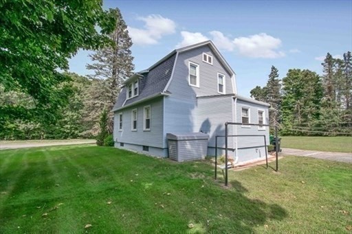 1307 Burnett Road Chicopee, MA 01020 - Photo 35 of 41 a view of a house with a yard
