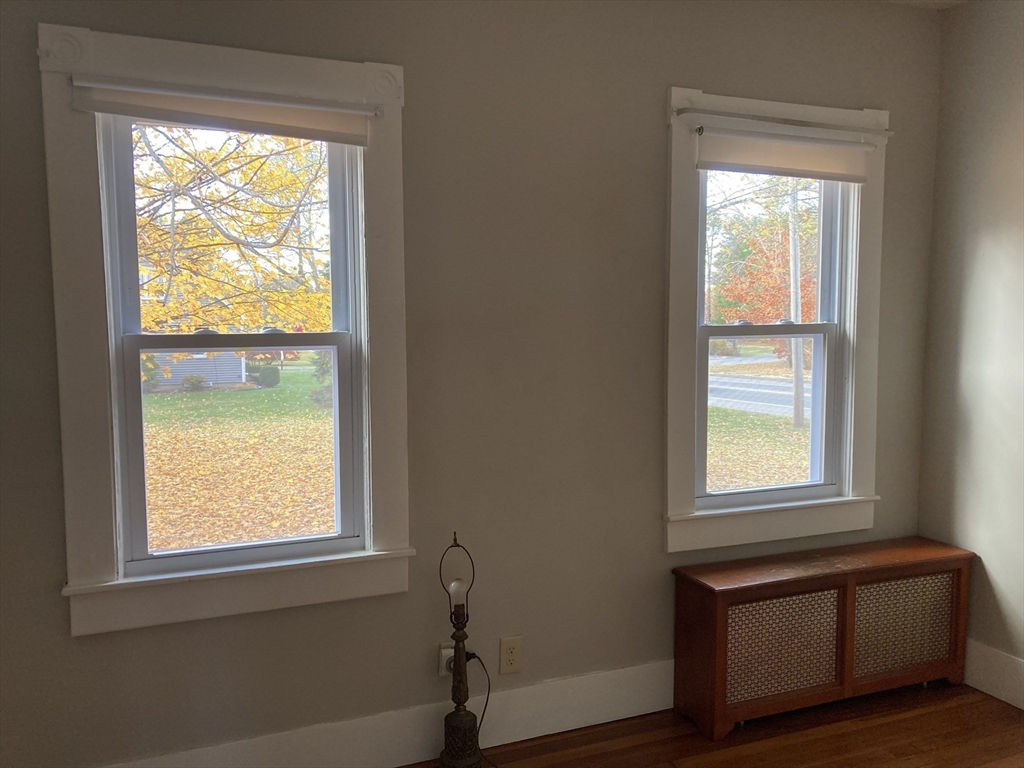 1307 Burnett Road Chicopee, MA 01020 - Photo 41 of 41 a view of an empty room with wooden floor and a window