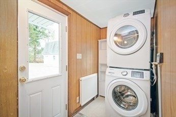 1307 Burnett Road Chicopee, MA 01020 - Photo 8 of 41 a view of a hallway with washer and dryer