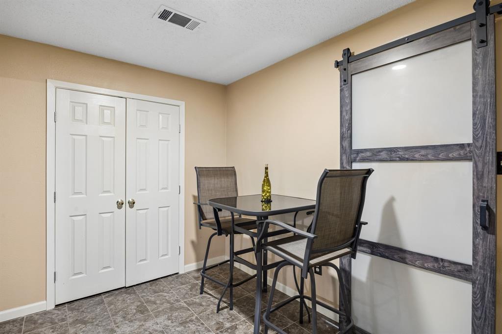 2617 Quail Ridge Irving, TX 75060 - Photo 13 of 17 Modern barn door with dark wood-finish framing