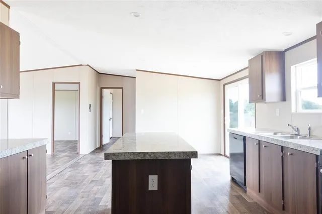 a kitchen with a sink and a refrigerator
