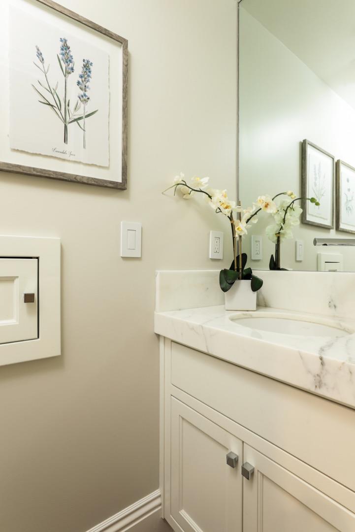 319 Walsh Road Atherton, CA 94027 - Photo 18 of 28 a bathroom with a sink and a mirror