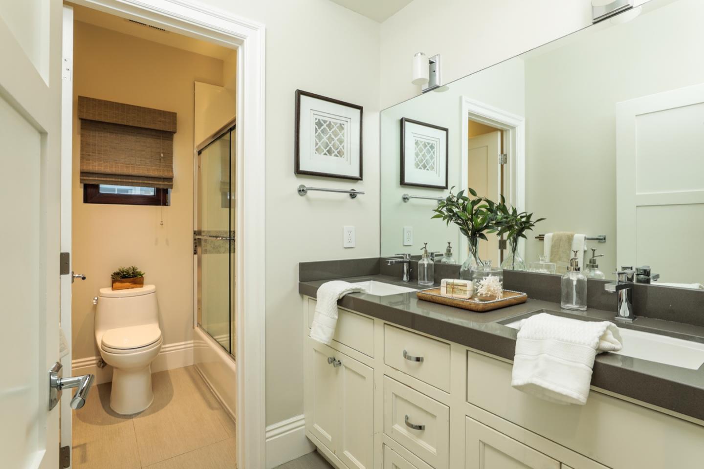 319 Walsh Road Atherton, CA 94027 - Photo 19 of 28 a spacious bathroom with a granite countertop sink and a mirror