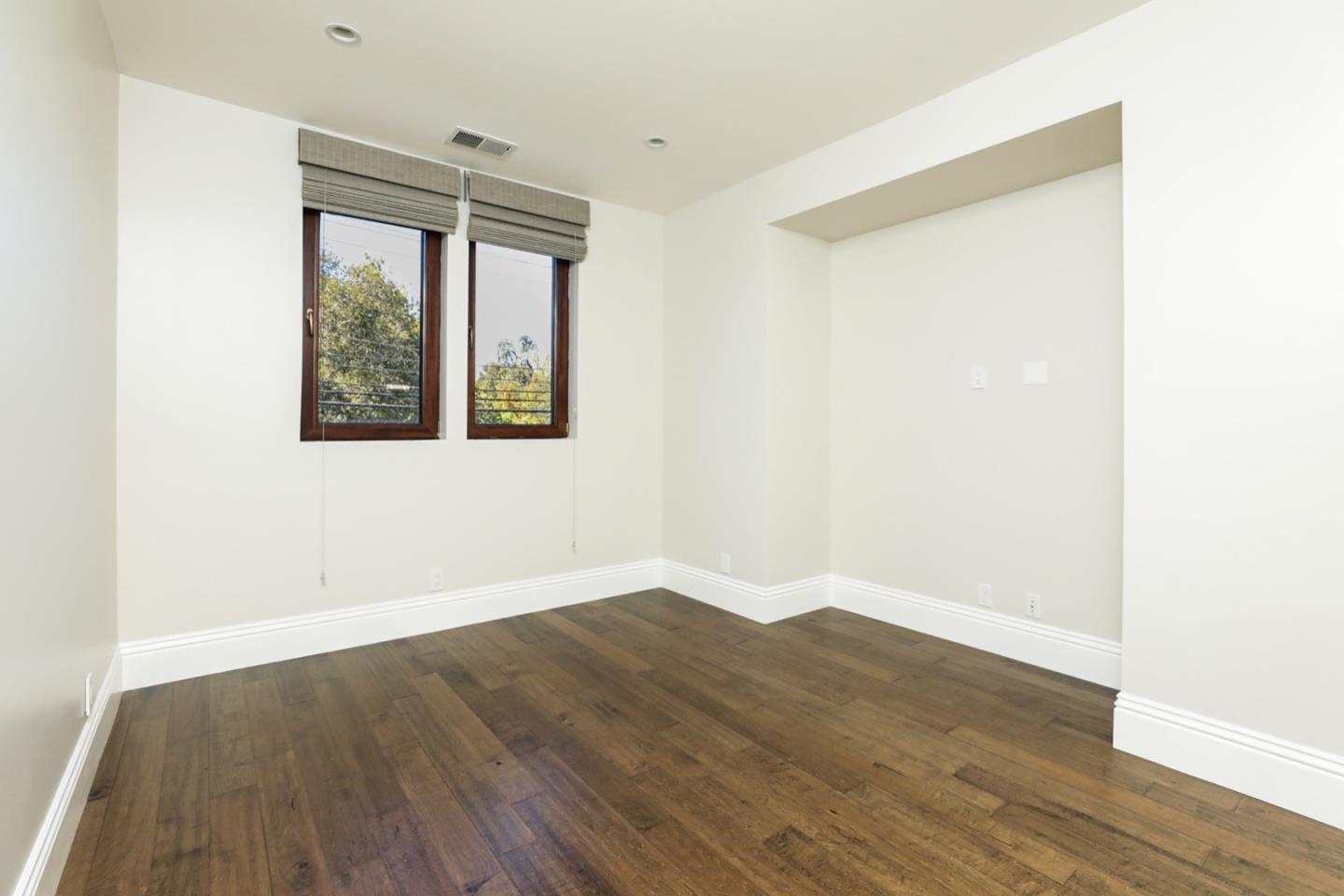 319 Walsh Road Atherton, CA 94027 - Photo 20 of 28 an empty room with wooden floor and windows