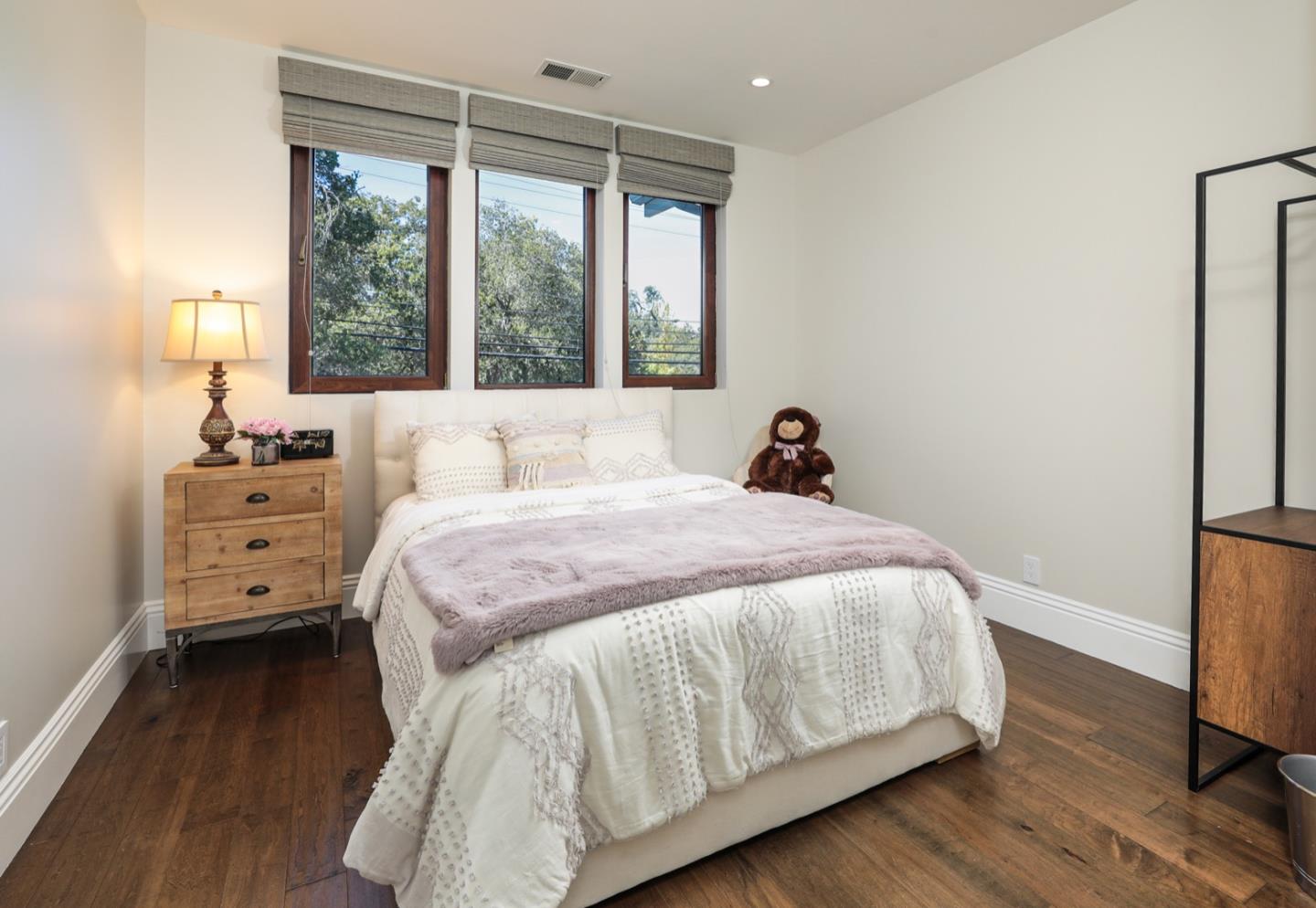 319 Walsh Road Atherton, CA 94027 - Photo 21 of 28 a bedroom with a bed and large windows
