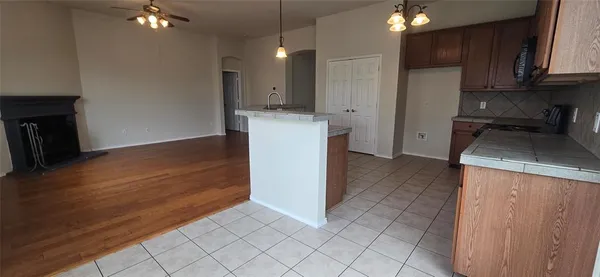 a kitchen with a sink and a stove top oven