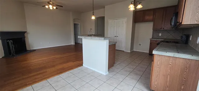 a kitchen with a sink and a stove top oven