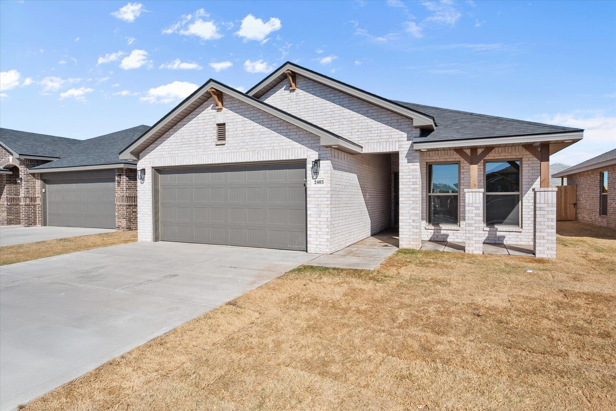 a view of garage and yard