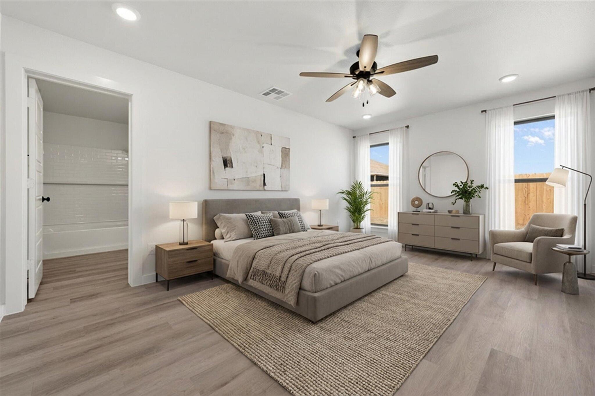 2403 Helena Avenue Lubbock, TX 79407 - Photo 16 of 25 a bedroom with a large bed and a chandelier