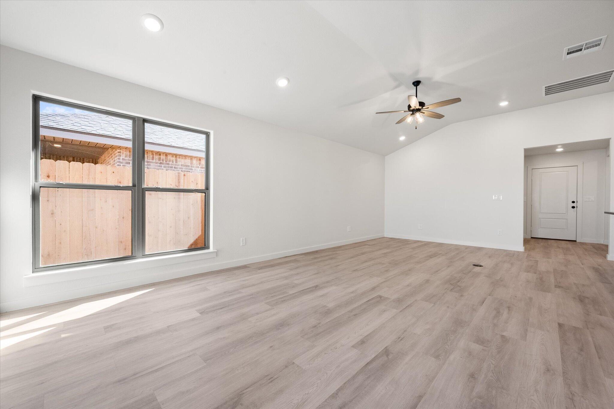 2403 Helena Avenue Lubbock, TX 79407 - Photo 7 of 25 a view of an empty room with a window