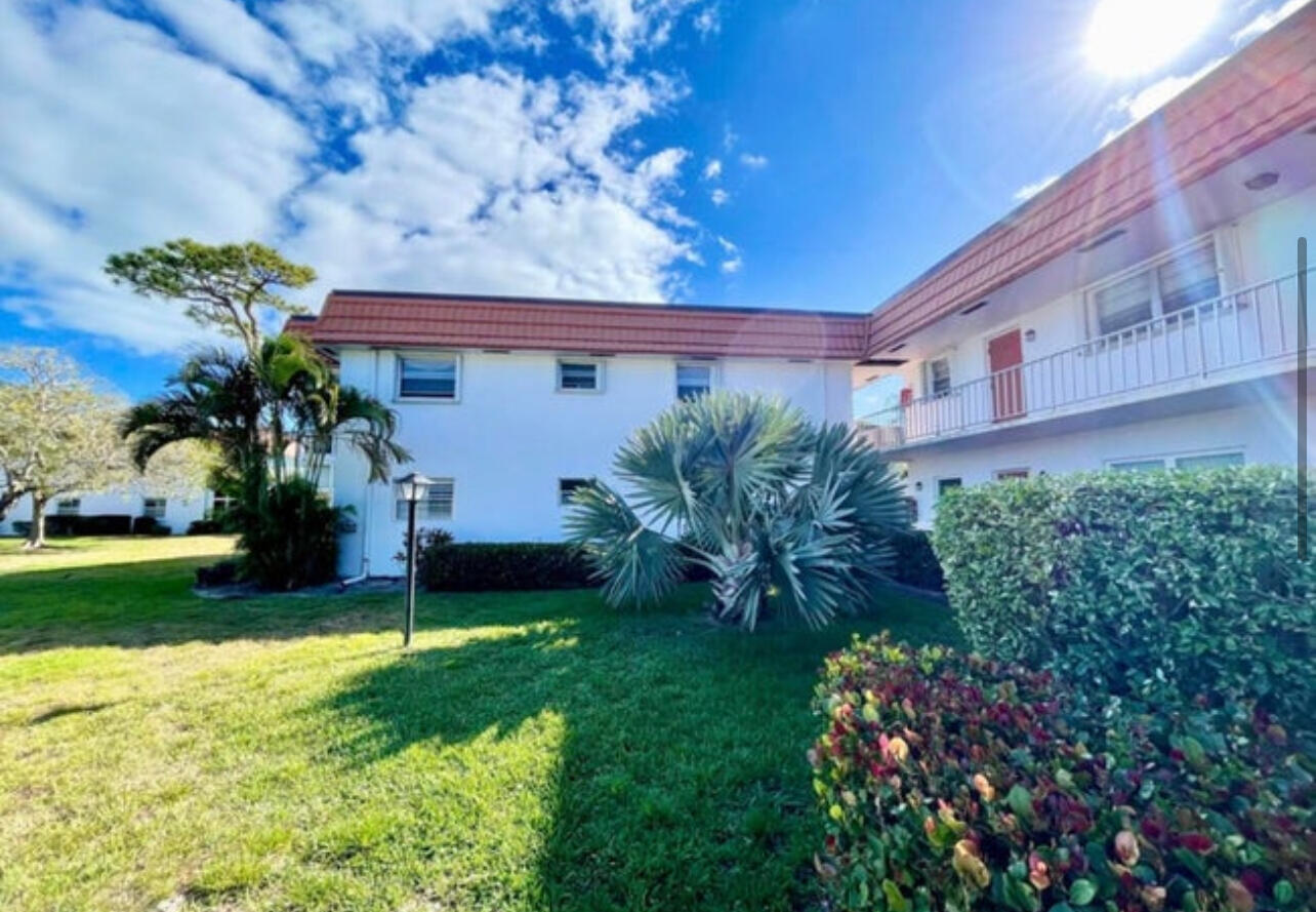 2600 Southeast Ocean Boulevard, Unit A2 Stuart, FL 34996 - Photo 1 of 16 a front view of a house with a yard