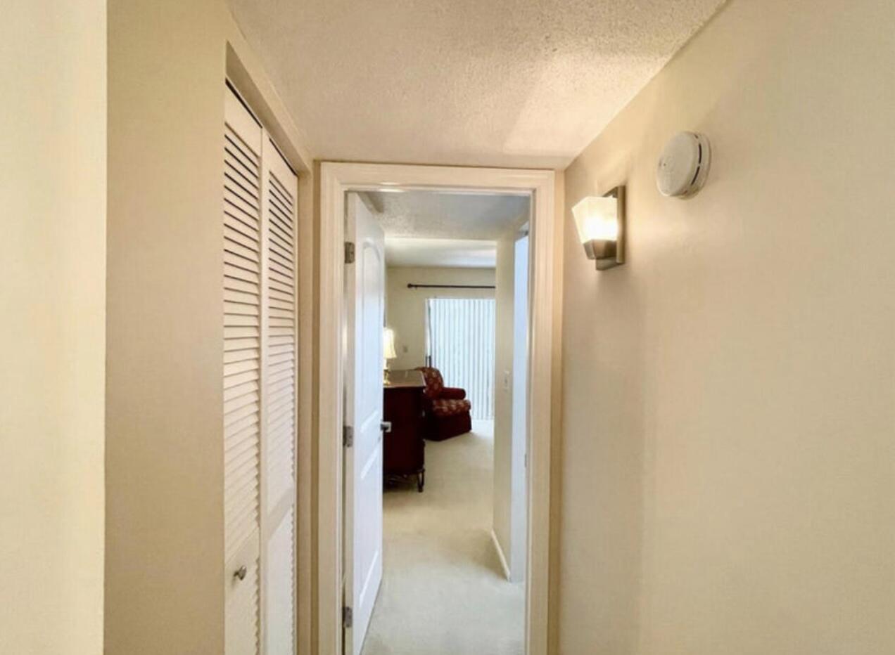 2600 Southeast Ocean Boulevard, Unit A2 Stuart, FL 34996 - Photo 11 of 16 a view of a hallway with closet and a couch