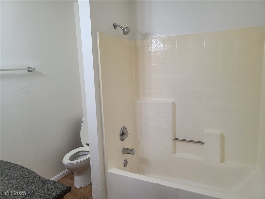 9325 West Desert Inn Road, Unit 233 Las Vegas, NV 89117 - Photo 10 of 10 Bathroom featuring washtub / shower combination and tile patterned floors