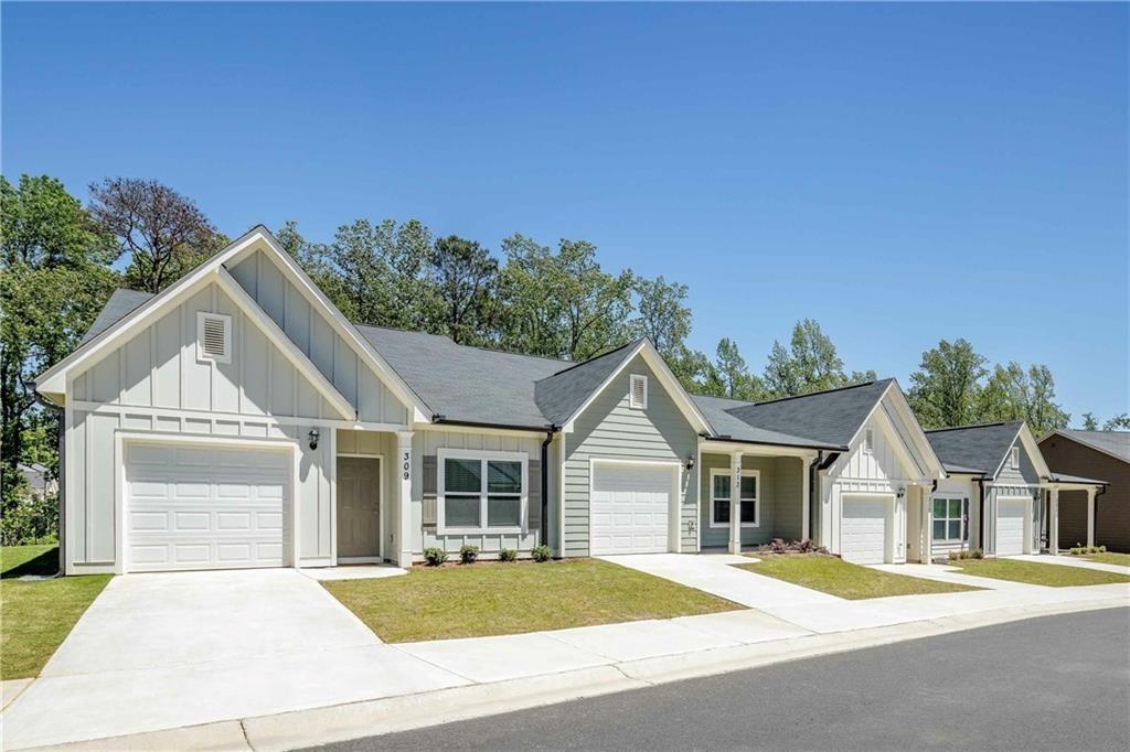 101 Walker Ridge Lane, Unit CARAWAY Cartersville, GA 30120 - Photo 1 of 40 a front view of a house with a garden