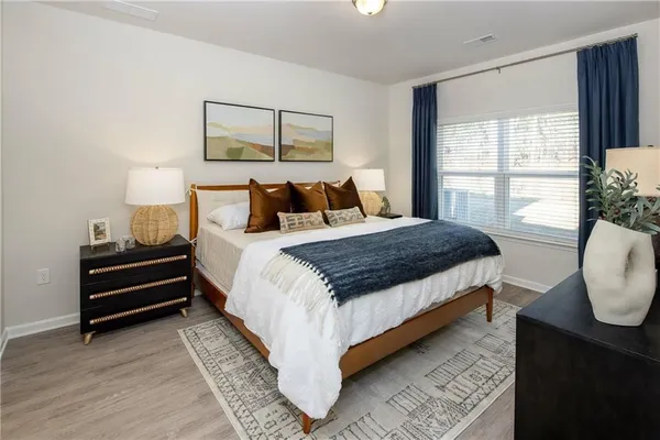 a bedroom with a bed and window