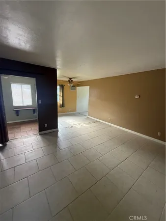 a view of a livingroom with a kitchen
