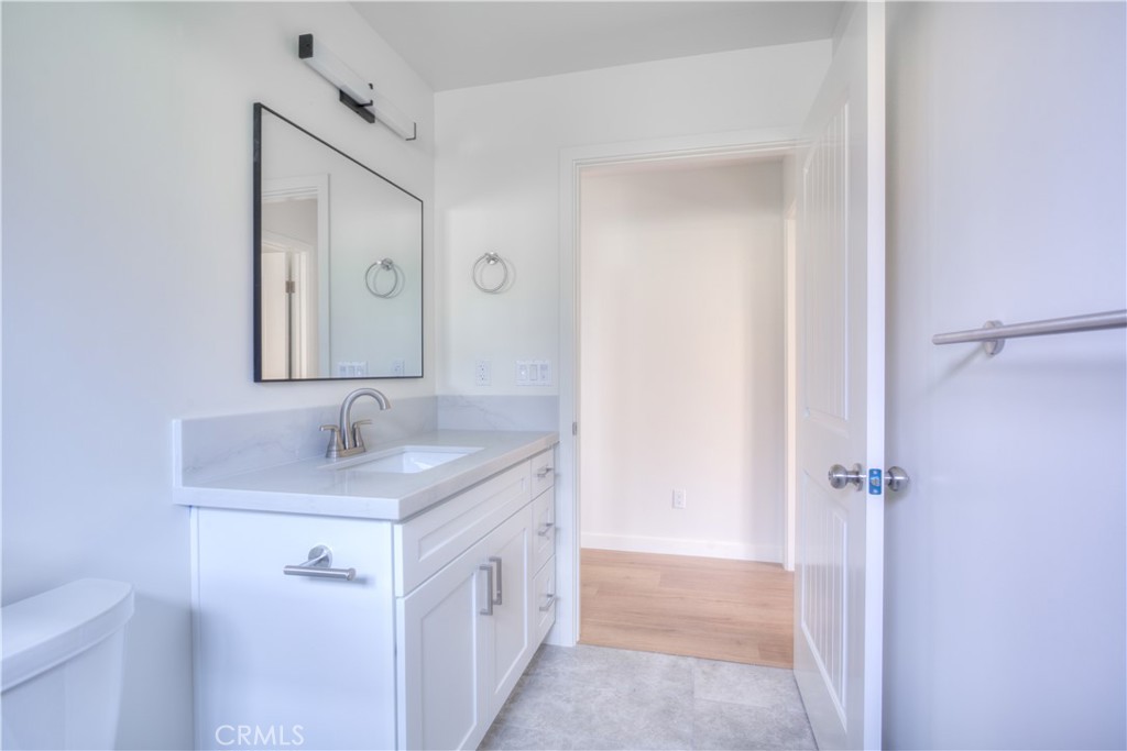 1806 South 8th Street, Unit A Alhambra, CA 91803 - Photo 11 of 23 a bathroom with a granite countertop sink a mirror and a