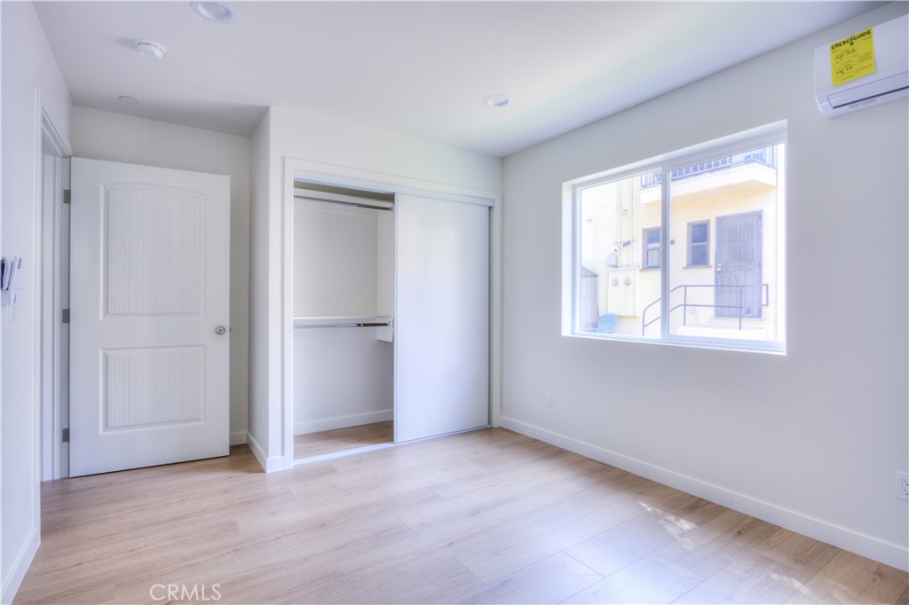 1806 South 8th Street, Unit A Alhambra, CA 91803 - Photo 16 of 23 an empty room with windows and closet