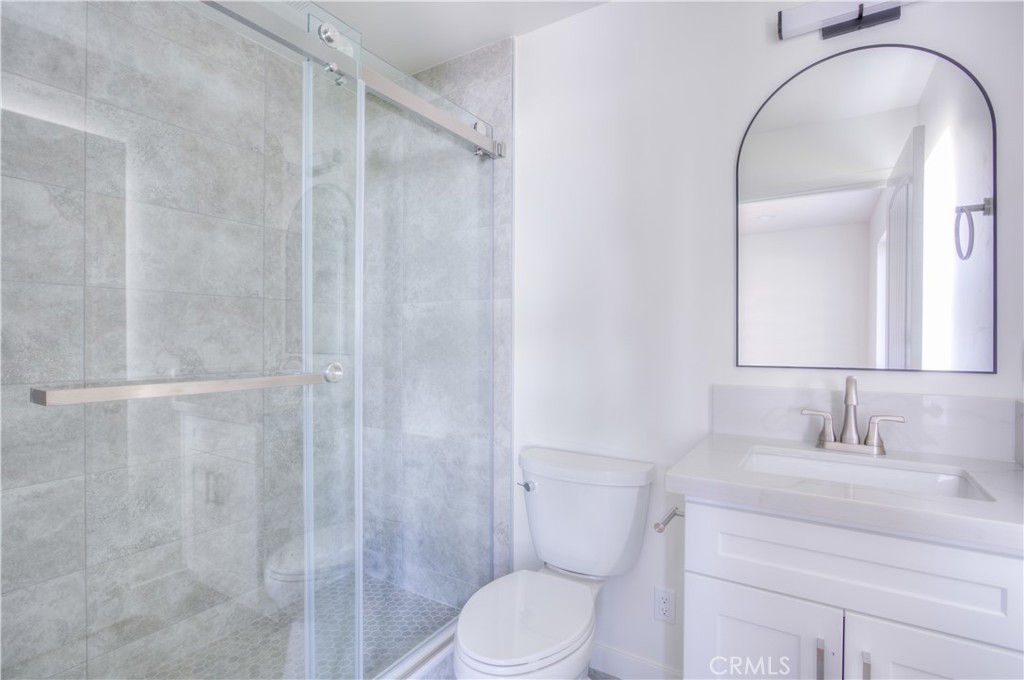 1806 South 8th Street, Unit A Alhambra, CA 91803 - Photo 18 of 23 a bathroom with a sink toilet and shower
