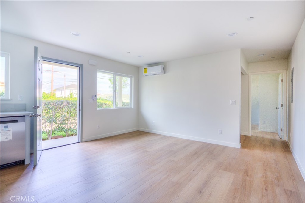 1806 South 8th Street, Unit A Alhambra, CA 91803 - Photo 5 of 23 an empty room with wooden floor and windows