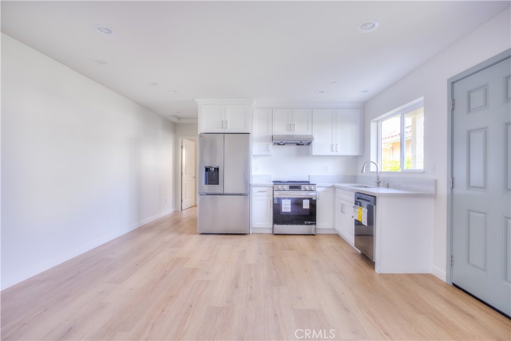 1806 South 8th Street, Unit A Alhambra, CA 91803 - Photo 7 of 23 a kitchen with stainless steel appliances a refrigerator and a stove top oven