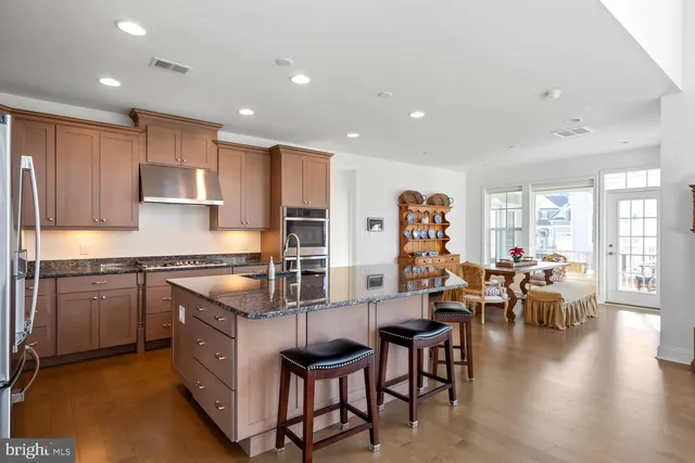 a dining room with furniture and wooden floor